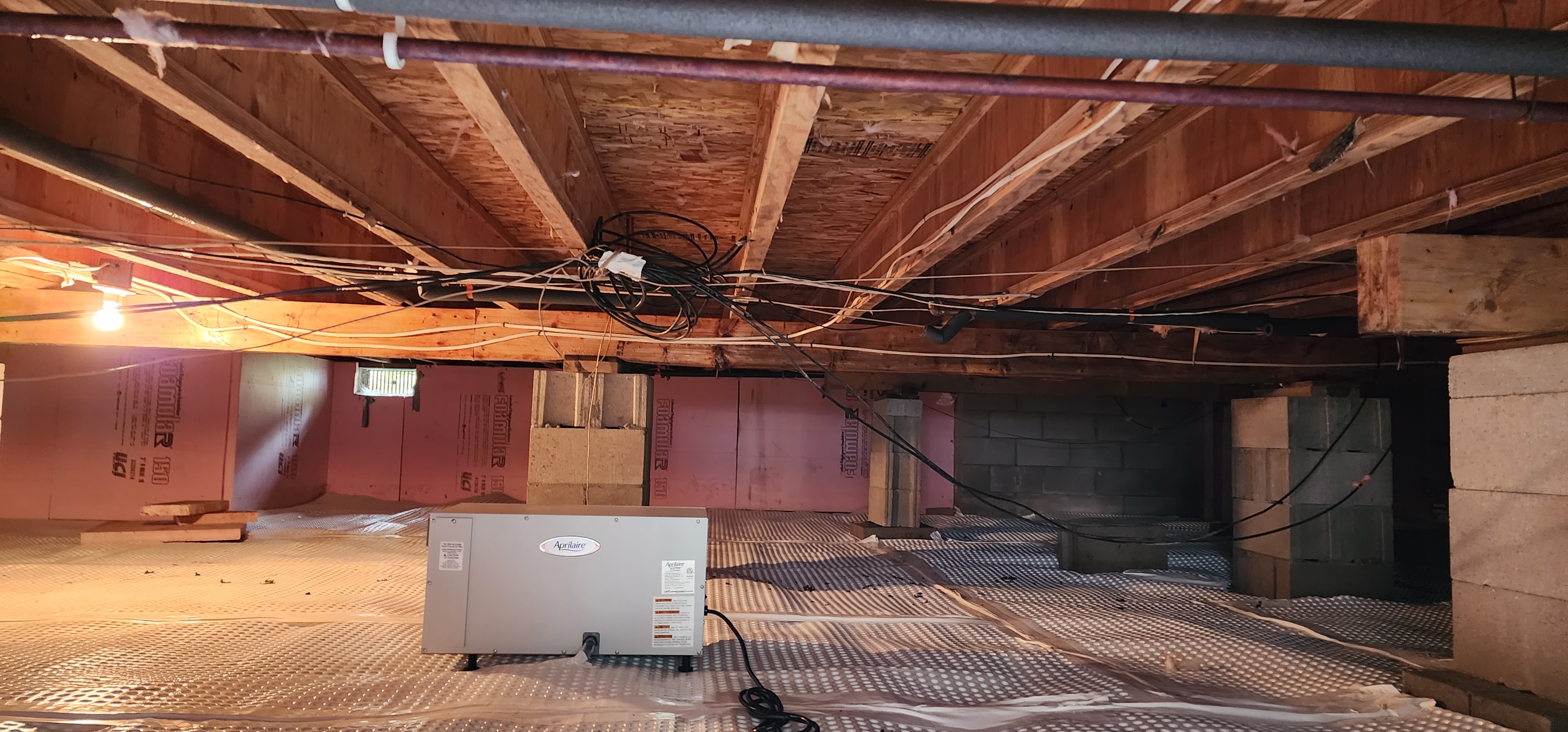Crawlspace encapsulation in a home in Indian River, Michigan, ensuring protection and improved air quality.