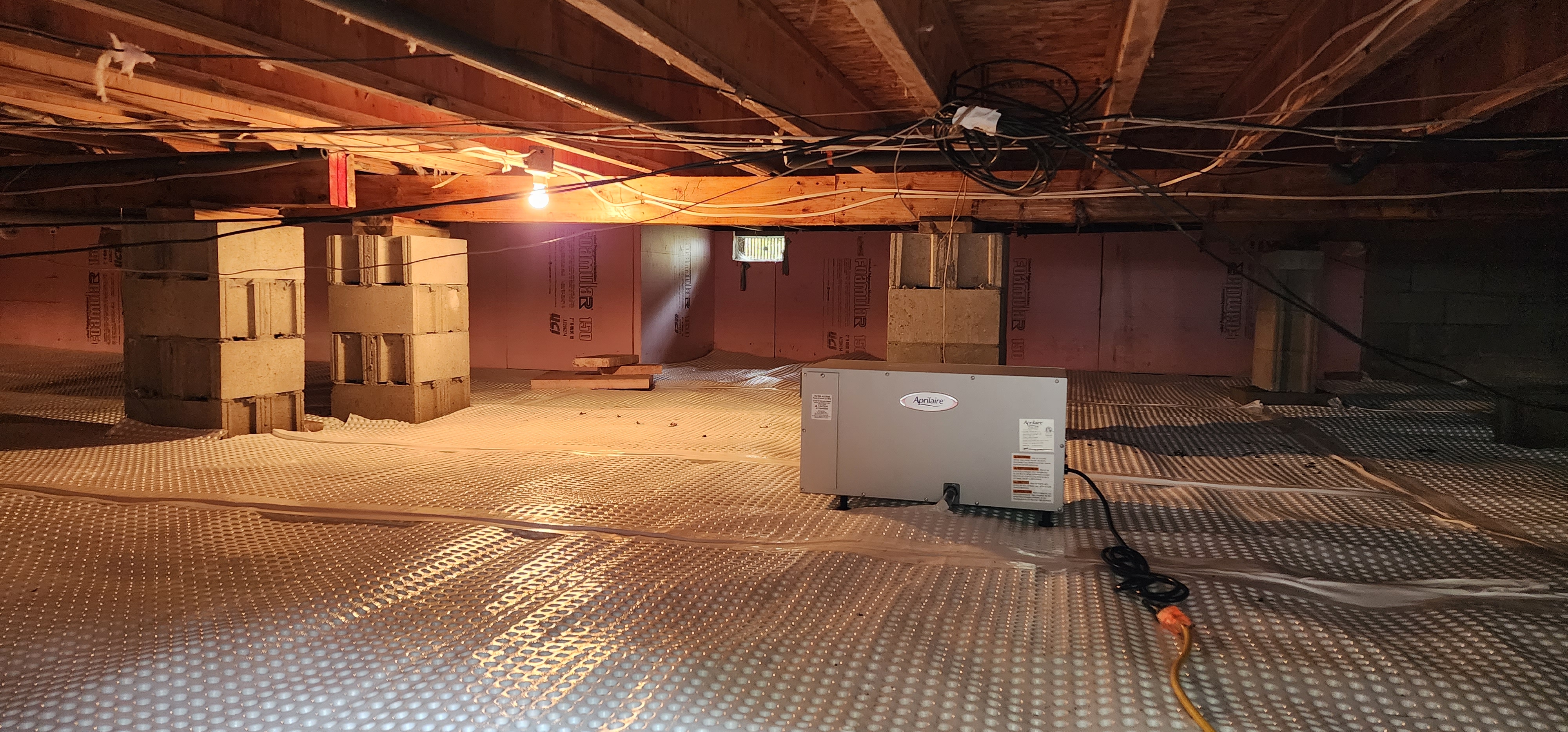 Crawlspace encapsulation in a residential home in Sand Lake, Michigan