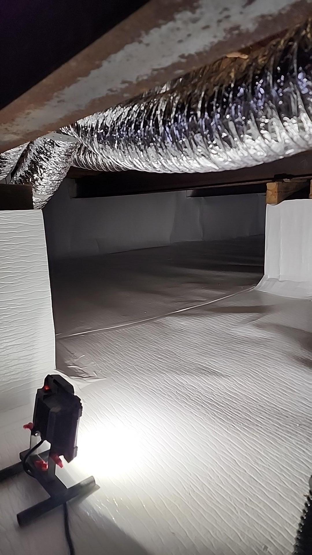 Crawlspace encapsulation process in a Harrison home.